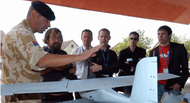 Royal Artillery personnel explaining operation of the Desert Hawk UAV